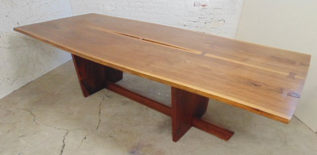 Mira Nakashima Minguren dining table March 1999: Mira Nakashima dining table, 9', 47" wide, 28.5" tall excellent condition, consigned by original owners with drawing and receipt. Note, all property herein offered for sale is strictly "as is", and it
