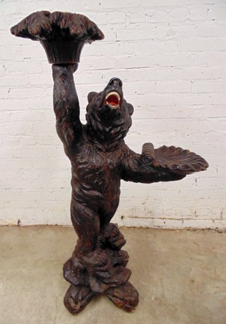 Vintage carved Black Forest standing bear holding wood: Carved bear holding wood bowl, glass eyes, original condition, 47.5" tall nice old patina Note, all property herein offered for sale is strictly "as is", and it is the bidder's responsibility, whether
