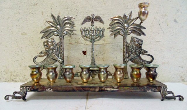 800 silver Menorah, lions & palm trees: 800 silver Menorah, lions & palm trees, 11.25" long, 6.5" tall, 2.25" deep. Note, all property herein offered for sale is strictly "as is", and it is the bidder's responsibility, whether bidding in pe