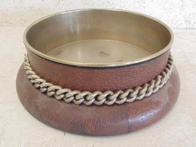 Gucci metal lined, leather wine coaster: Gucci metal lined, leather wine coaster, 6.75" outside diameter, 5.25" inside diameter. Note, all property herein offered for sale is strictly "as is", and it is the bidder's responsibility, whether b