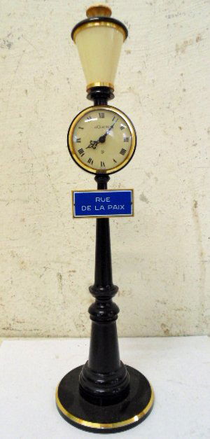 Le Coultre "streetlight" clock: Le Coultre "streetlight" clock, 11" tall, good condition. Note, all property herein offered for sale is strictly "as is", and it is the bidder's responsibility, whether bidding in person, by mail, by