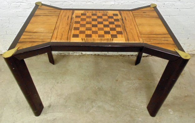 Inlaid game table with reversible top, brass corners: Inlaid game table with reversible top, brass corners, some scratches. Some damage to margin, minor staining of paper. Table is 43.5" wide, 30.25" deep & 29.5" high. Note, all property herein offered f