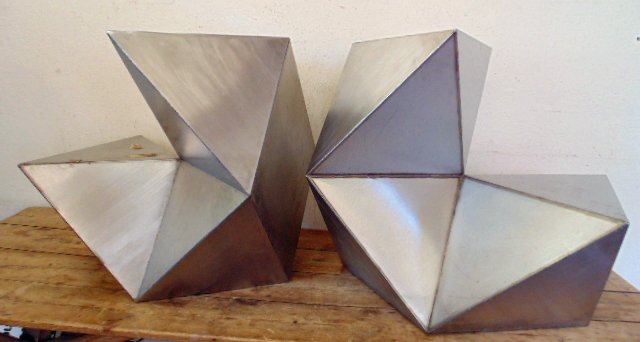 2 part stainless steel sculpture by Tony Smith: 2 part geometric stainless steel sculpture by Tony Smith, 26" by 26" by 18.5" ea, light scratches, overall in good condition, not signed.Estate info is a 1970's purchase from Doyles in New York City,
