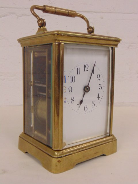 Brass carriage clock: Brass carriage clock, no maker, 5.25" tall. Note, all property herein offered for sale is strictly "as is", and it is the bidder's responsibility, whether bidding in person, by mail, by e-mail or by t
