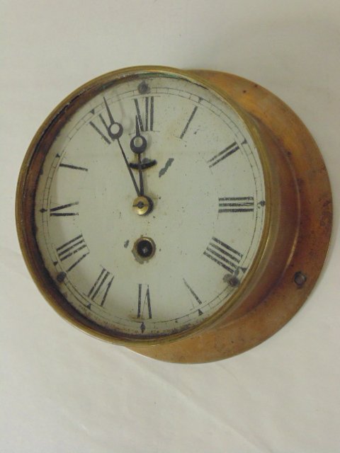 New Haven brass ships bell clock: New Haven brass ships bell clock, back 7 2/8" diameter, front is 5.5", paint loss at edge dial. Note, all property herein offered for sale is strictly "as is", and it is the bidder's responsibility, w