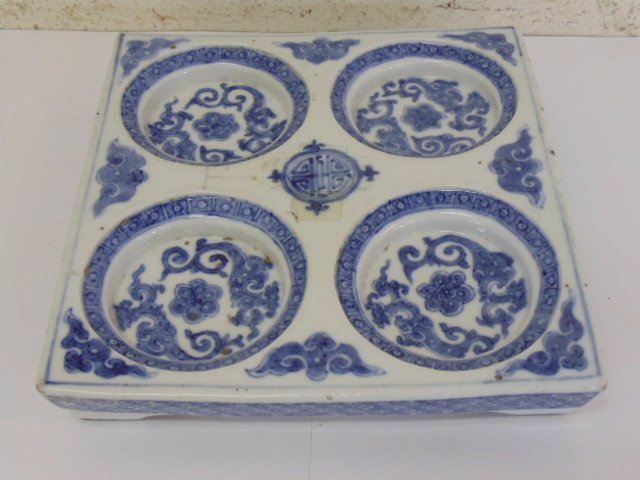 Asian blue & white porcelain tray with 4 round recessed: Asian blue & white porcelain tray with 4 round recessed bowls, 7.75" by 7.25", minor chips
