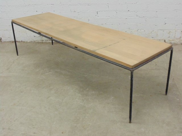 Mid Century Paul McCobb maple and iron coffee table: Mid Century coffee table, wood top, iron base, Paul McCobb, top 59" by 17.25", height is 15.75", top weathered, ends split, needs refinishing