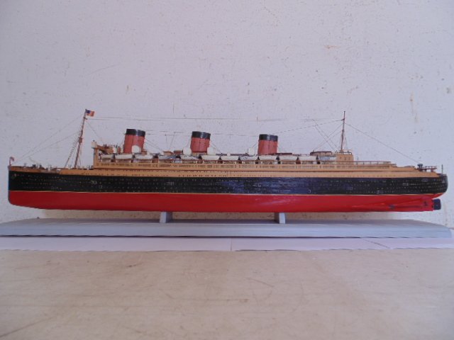 Boat model, "Queen Mary", 32" long, in glass case: Boat model, "Queen Mary", 32" long, in glass case, wood & paper construction, some paint loss.