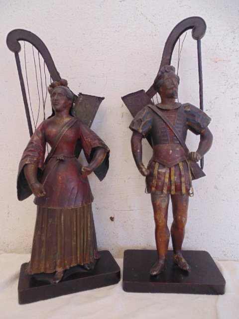 Pair figural tole planters, 18th Century: Pair figural tole planters, man & woman figure. Tole in original paint, both figures carry a harp which holds flowers, in original condition, paint is worn, chipped, strings to harps are loose, some m