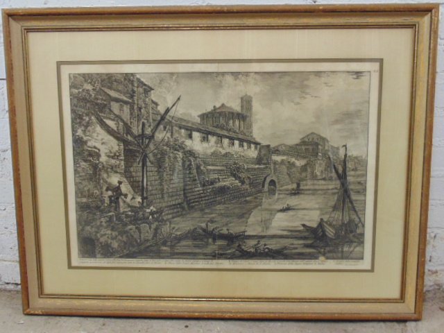 Piranesi etching scene with boats on canal near wall: Piranesi etching scene with boats on canal near wall, number 55, fold mark through center, 18.5" by 27.75". Please refer to images for general condition issues, all items sold as is.