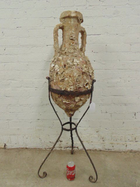 Shell encrusted amphora on iron stand (1 of 6)