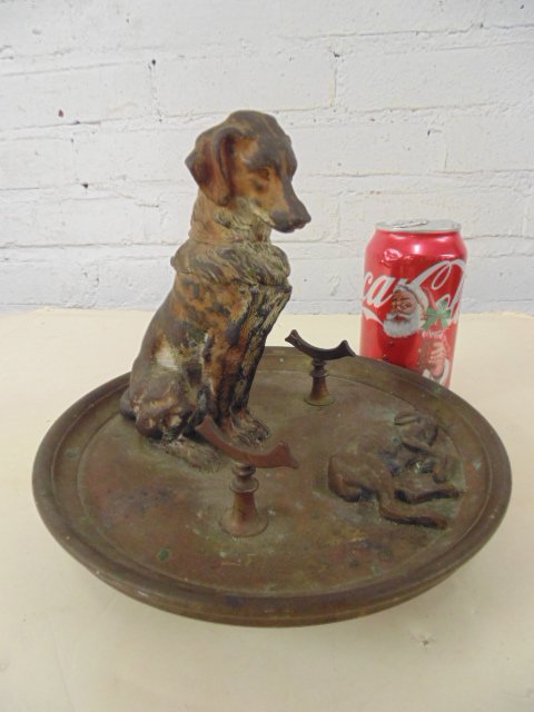 Bronze dog inkwell, cold painted: Bronze dog inkwell, cold painted, dog looking at game, with pen rest, paint worn, base is silverplate, found in Cold Spring estate attic, height is 6.5", diameter base is 8.25"