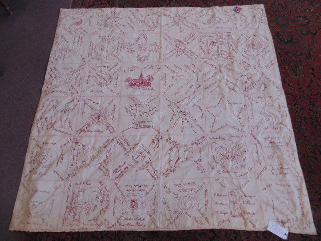 White quilt with red embroidered family names (1 of 8)