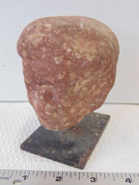 Carved stone head, temple carving (1 of 5)