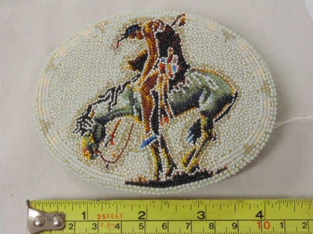 "End of the Trail" buckle by Edgar Jackson, Shoshoni: "End of the Trail" buckle by Edgar Jackson, Shoshoni, American Indian beadwork, in good condition. 3 1/4" by 4 1/4"