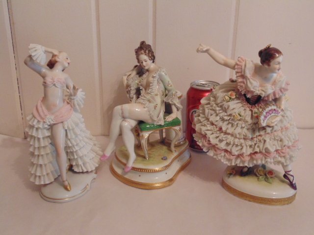3 porcelain Dresden figurines: 3 porcelain Dresden figurines; including a dancer, nude on chair, and a dancer holding fan (pieces missing from dress, finger missing); nude on chair is be a lamp base; average height 9"; please refer