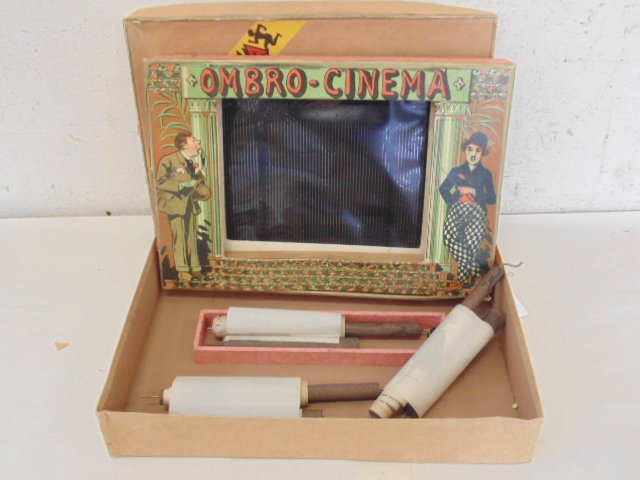 L\'Ombro-Cinéma, 1920. Optical game with 3 rolls: L\'Ombro-Cinéma, 1920. Optical game with 3 silhouette image rolls, 2 black & white rolls, Film # 7 \"Au Cirque\" , film 9, \"Gullivera Lilliput-Gulliver chesles Geants\" & a color film, \"film # 20, 