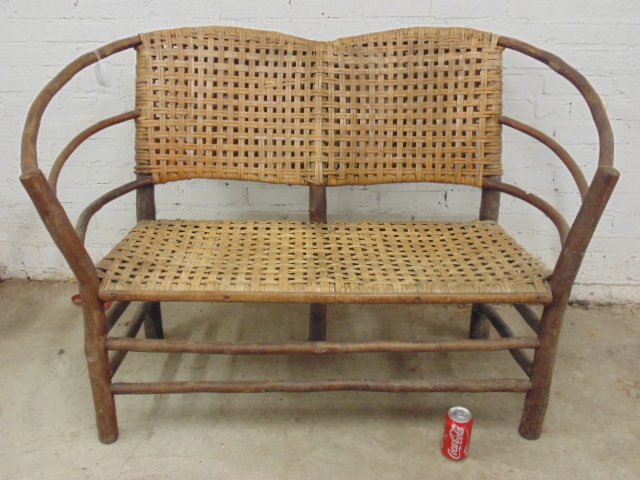Old Hickory loveseat, woven seat & back: Old Hickory loveseat, woven seat & back, weathered appearance, good condition, width is 53.5", depth is 27", height is 35"