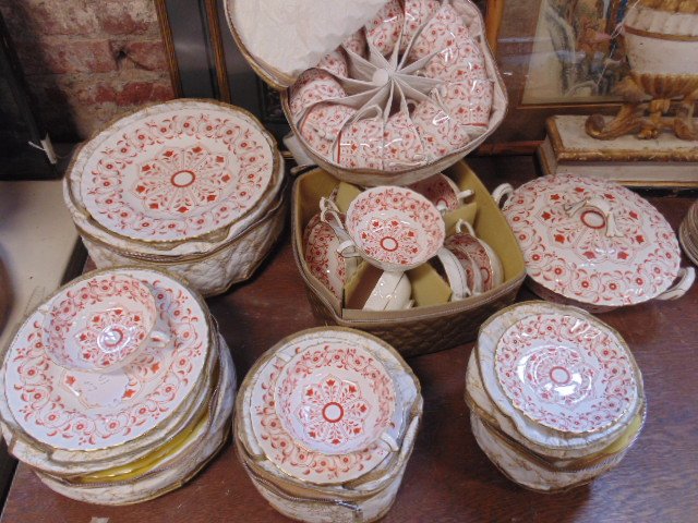 Set porcelain dinnerware by Royal Crown Derby: Set of Royal Crown Derby English Bone China, red & gilt decoration, consists of 12 double handled cups with saucers, 12 cups with 14 saucers, 12 8.5" plates, covered bowl & 12 dining plates 10.5",