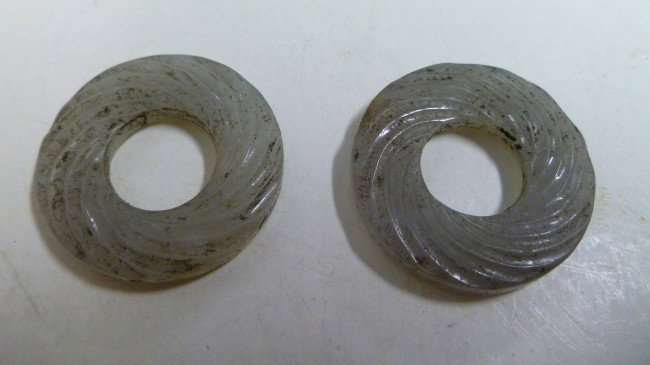 White Jade "RINGS": PAIR of quality ancient Manchurian White Jade Rings of the Eastern ZHOU Period 770BC-207BC). Twist design, likely attached originally with prrecious metal wire that did not survive. Very hard Jade, an