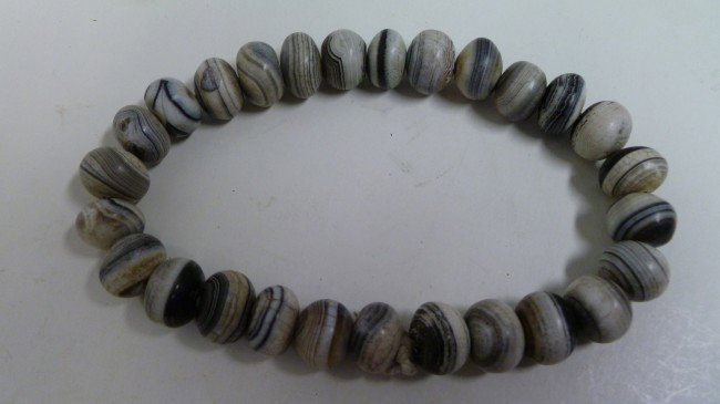 String: Banded Agate Beads: Used as Prayer Beads by Buddhist practitioners, these may have been made during the pre-Buddhist Han period, but kept or found and later adopted for a Rosary during the Six Dynasties or thereabouts. 2