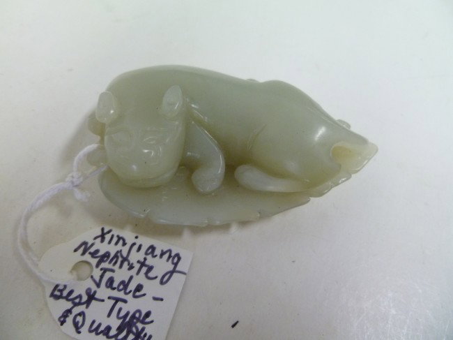 CAT-LIKE ANIMAL on a LEAF: XINJIANG NEPHRITE of fine grain and top quality, it is the off-white color known as "mutton fat". Top carving and exceptional hand polishing to a "soft lustre" make this a premium example of the Jade 
