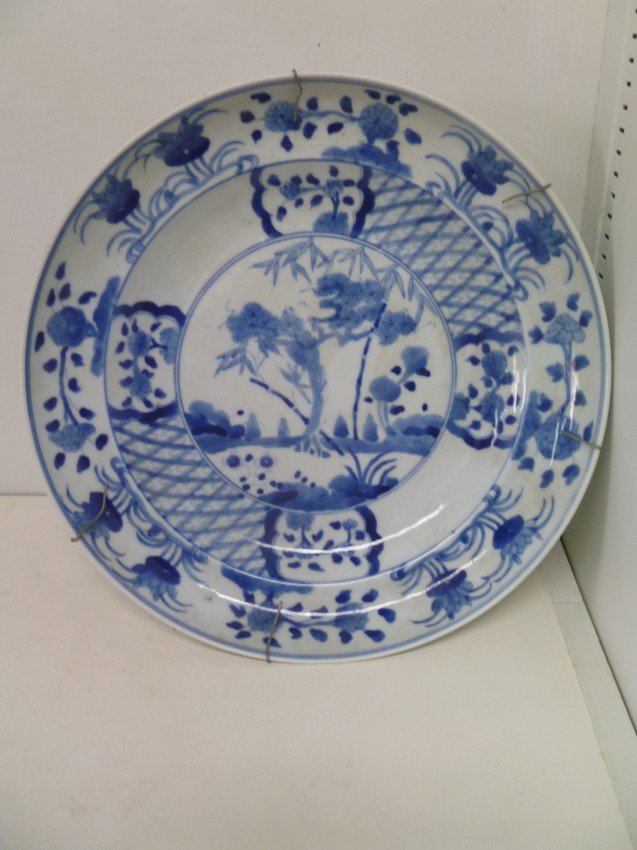 BLUE & WHITE QING-STYLE PLATE: The 10-1/2" across "dished-form" Porcelain is well-painted on a doubled cavetto and central rondel. Early Republic period, 1915-1925.