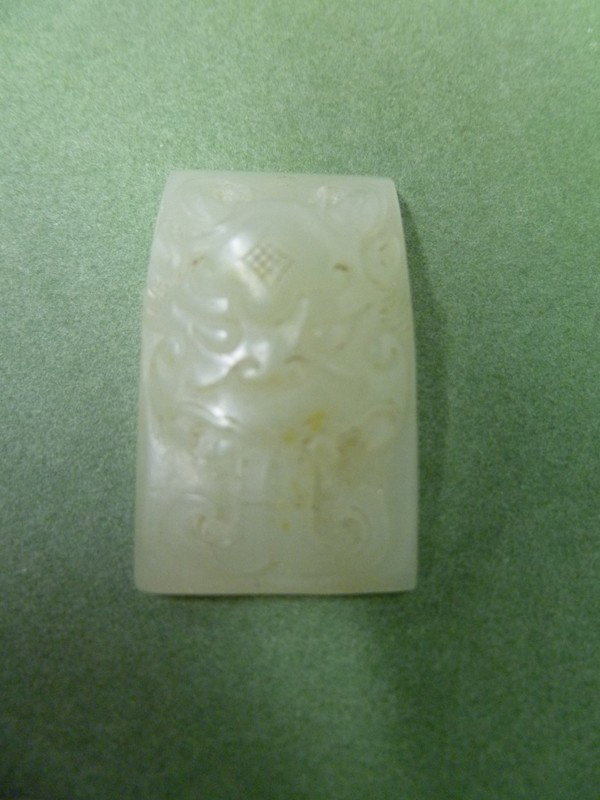 041: Fierce PROTECTIVE-DEITY Jade: Small but VERY FINE, it shows a Demonic Head with two prominent horns and a protruding forked tongue - which was believed to ward off Evil. On the back are carefully incised two facing PHOENIX Birds w