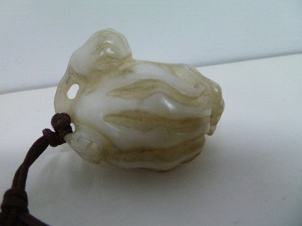 Buddhas Hand Citron Jade: The good white colored very hard stone had dirtied a bit from use after unearthing. The Buddhist image was never finished in the polishing of the inner lines, indicating it was mingqi,or grave goods/a