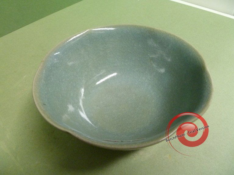 QING: TEAL BLUE LOBED BOWL: Finest glaze in a desirable Qing color, this rice bowl is Kuanyao quality with one minor black speck on the inner rim area. 5-1/4" across, the 6-lobed bowl is 17-18th C. and perfect.
