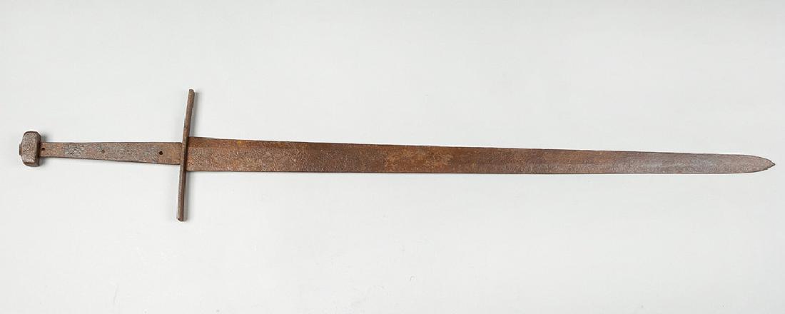 Large Medieval Iron Sword: Large Medieval Iron Sword, with canted blade, handprotection and grip, ending in rectangular knop, with holes for grip support. Earthfound, rusty.