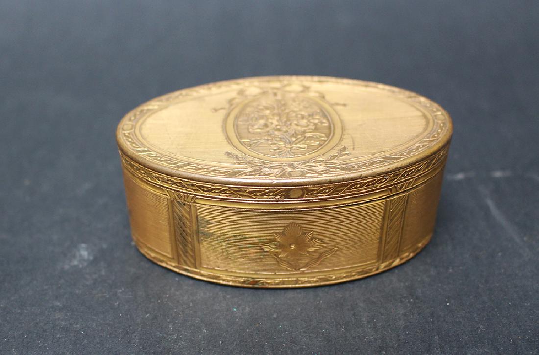 French snuff box: French snuff box, oval shape with one lid and rich engraved floral decorations, copper, gilded, late 18th Century.