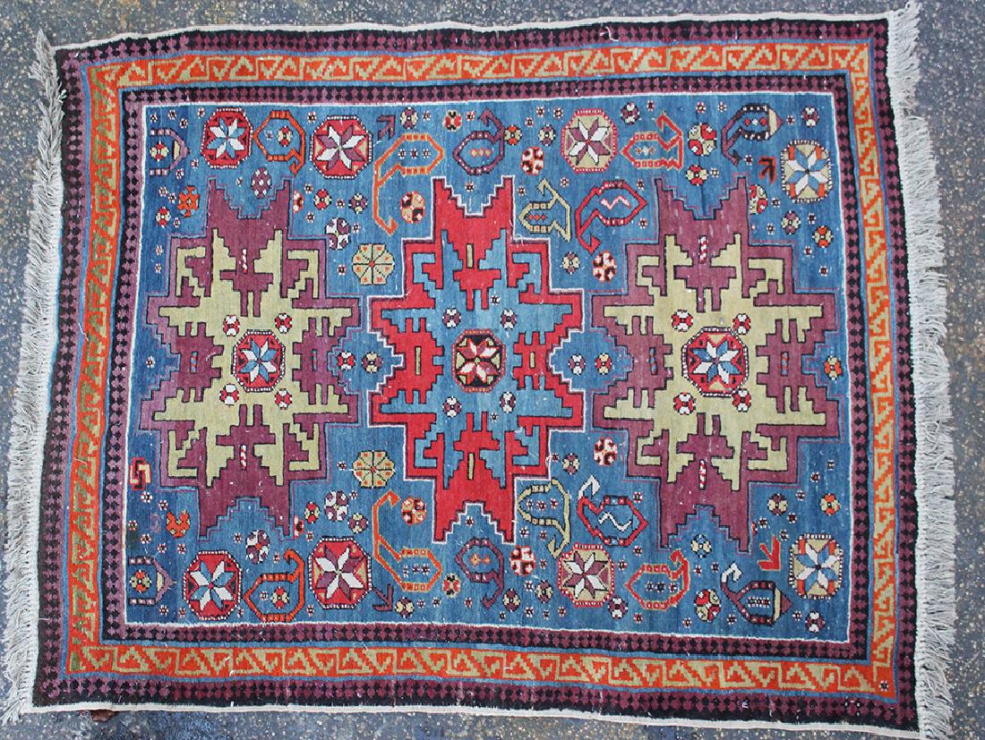 Small Oriental Carpet: Small Oriental Carpet decorated with geometrical objects and stars in blue, red, orange and beige colours, 19th/20th Century.