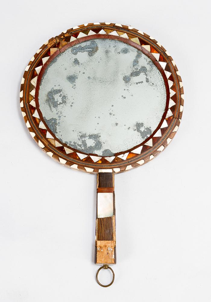Ottoman Ladyâ€™s Mirror: Ottoman Ladyâ€™s Mirror, with rich intarsia, mother of pearl, coloured hardwood and tortoise shell; damages; 18th Century. Dimensions: 38 cm length, diameter 24, 5cm