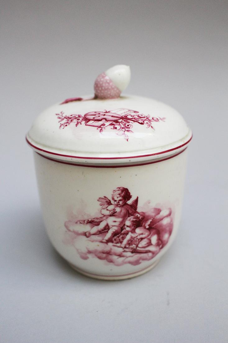Tournais, Belgium Porcelain sugar bowl: Tournais, Belgium Porcelain sugar bowl with lid, painted in red colours, with two pigeons symbolizing a marriage and two cupids, music instruments and a hazelnut, glazed, bottom marked, 18. century, 1