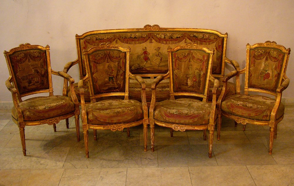 French Louis XVI style Salon suite, one sofa and 4 armc: French Louis XVI style Salon suite, one sofa and 4 armchairs wood carved and gilted with colloured Aubusson tapestry decorated with animals, dancing, feasting children, musicians and flowers. Gilting