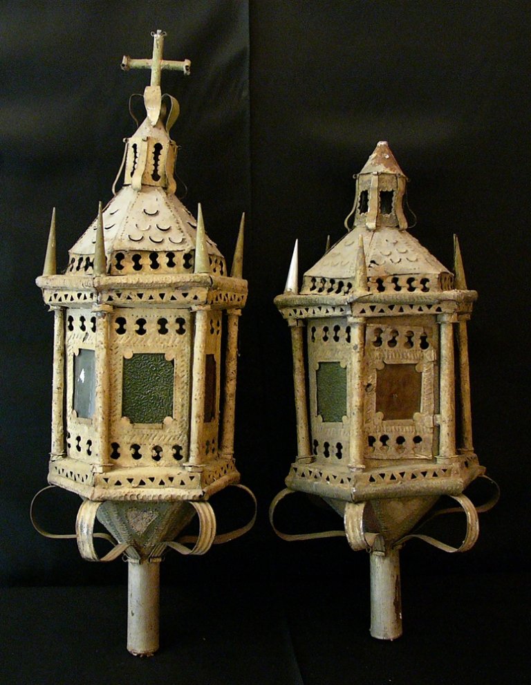 Pair of Spanish procession lanterns, iron with cutted: Pair of Spanish procession lanterns, iron with cutted ornaments and windows, on top with roof decoration and one ending with the cross, six sides, columns and coloured glass windows, partly with origi