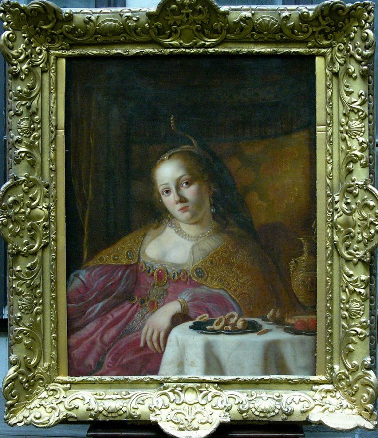 Ferdinand Bol (1616-1680)-follower, A richly draped: Ferdinand Bol (1616-1680)-follower, A richly draped lady with a pearl necklace and a crown sitting by a table with fruits and a gilded ewer, oil on canvas. Signs of age, scratches. In carved and gilde