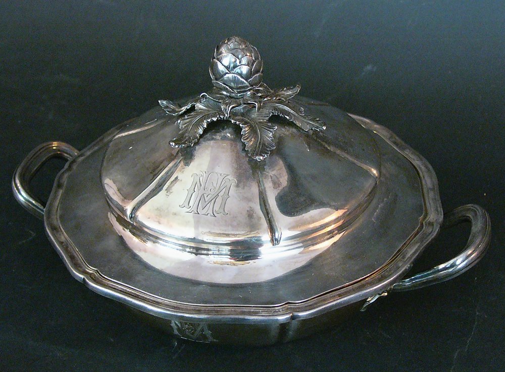 Casserole by Odiot Paris, shaped form with coat of: Casserole by Odiot Paris, shaped form with coat of arms, handgrips internal bowl lid and fruit ending, marked Odiot on the bottom, weight 1,85kg. Signs of age. diameter 25cm