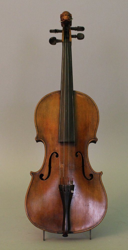 Bohemian or Hungarian violin with carved scroll and: Bohemian or Hungarian violin with carved scroll and original neck. Inside old paper label, 19th Century. length 60cm