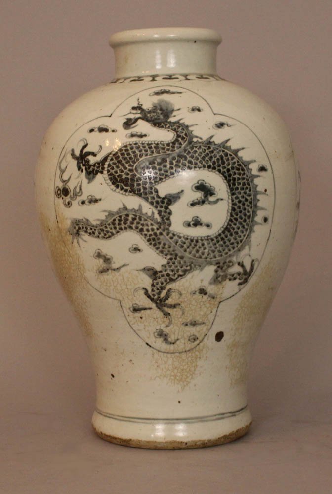 Chinese ceramic vase in Wang Li manner, in baluster sha: Chinese ceramic vase in Wang Li manner, in baluster shape, with small neck, painted with three cartouches with dragons and flower decorations, with dark blue colours on white ground, glazed; some smal