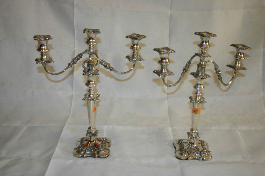 A pair of heavy silver plated two branch three lig: A pair of heavy silver plated two branch three light Candelabra, each with leaf cast scroll arm, 18" (46cms). (2)