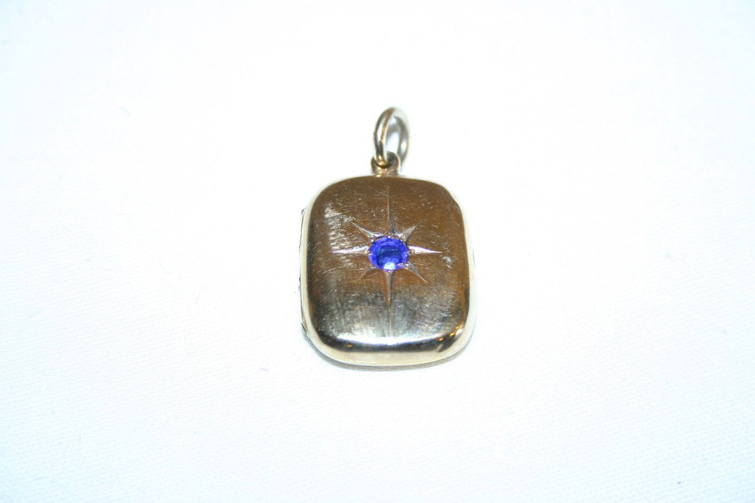 A 15ct gold Locket, with saphire type stone, 12g (: A 15ct gold Locket, with saphire type stone, 12g (overall). (1)