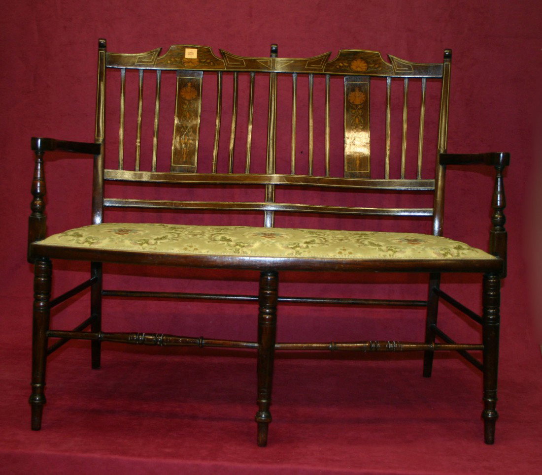 A grained rosewood, marquetry and bone inlaid sett: A grained rosewood, marquetry and bone inlaid settee, Edwardian, with slatted back and padded seat, 42" (107cms). (1).