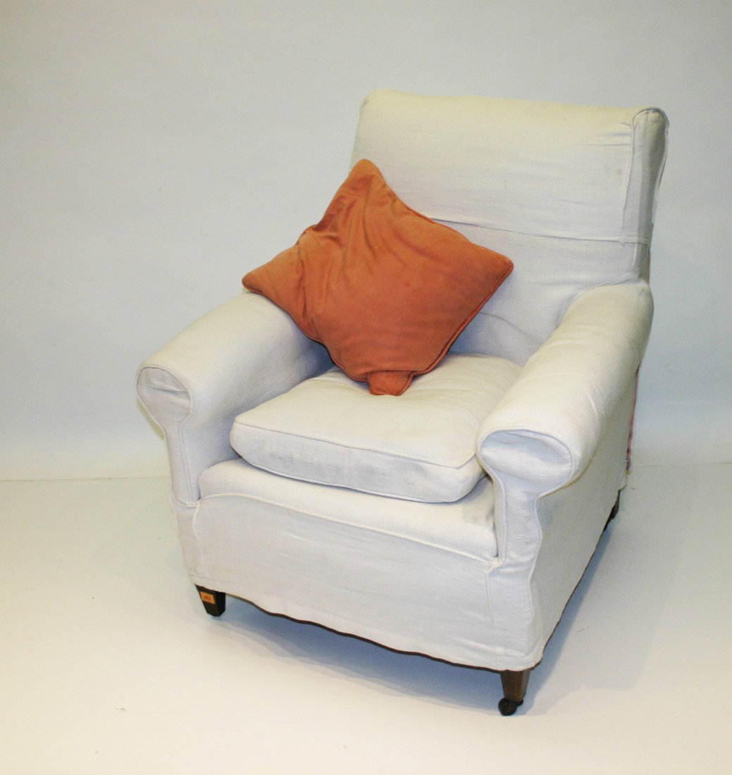 A three piece Suite of Seat Furniture comprising : A three piece Suite of Seat Furniture comprising a pair of Easy Armchairs with loose covers and cushions, together with a three seater Chesterfield type Settee, early 20th Century. (3)