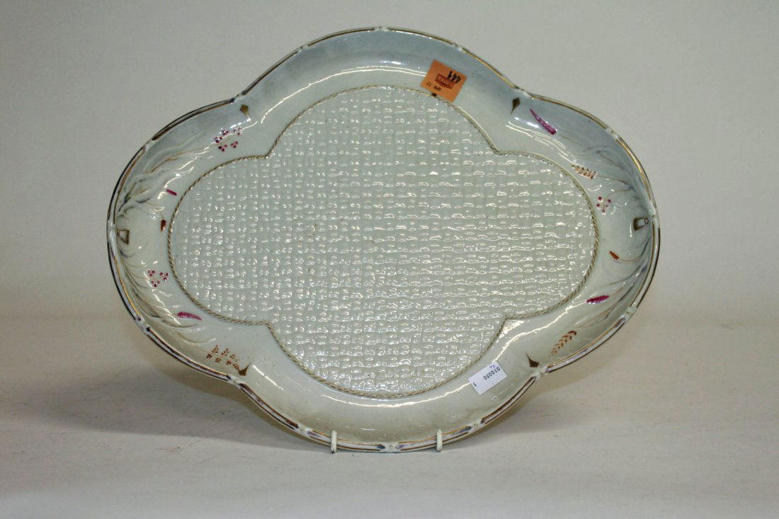 A Belleek quatrefoil grasses pattern tea tray, 1st: A Belleek quatrefoil grasses pattern tea tray, 1st period (1863-1890), decorated with a basket moulded centre, 17" (43). (1).