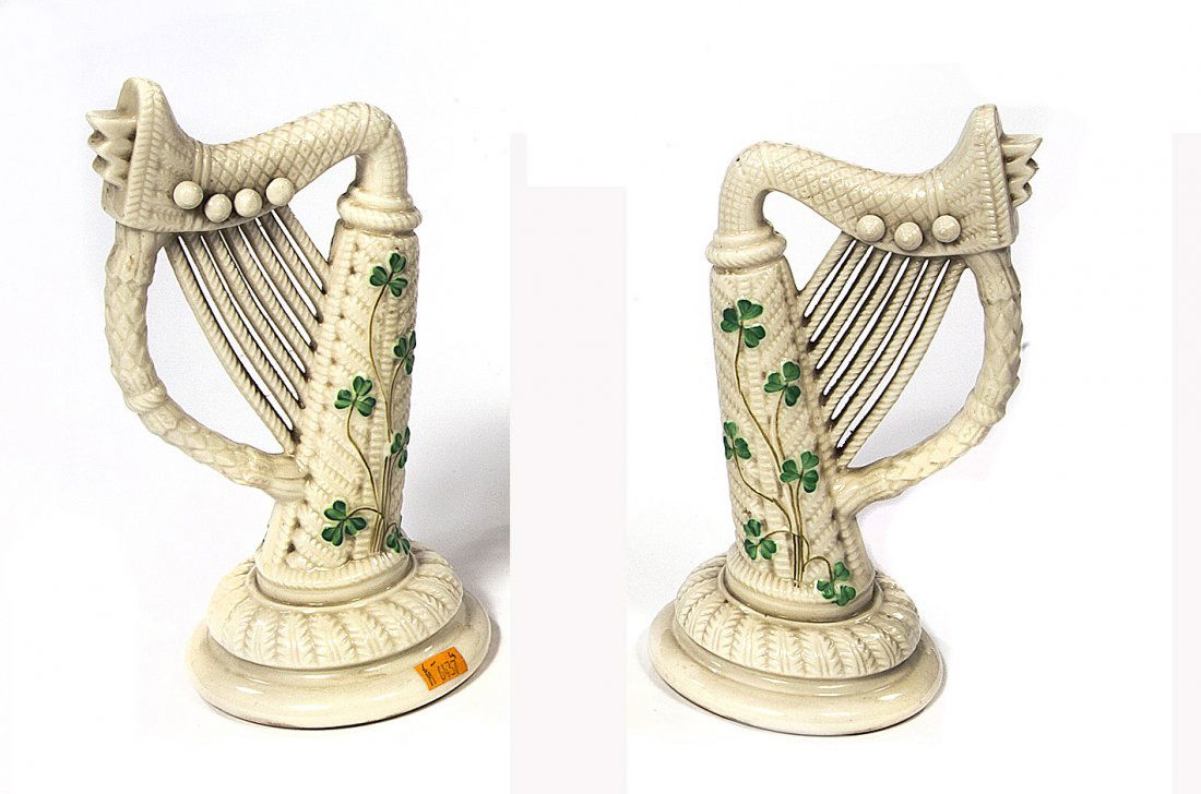 A pair of belleek shamrock decorated harps, 3rd pe: A pair of belleek shamrock decorated harps, 3rd period (1926-1946) D78, on circular leaf moulded cushion base, 8.75" (22cms). (1).