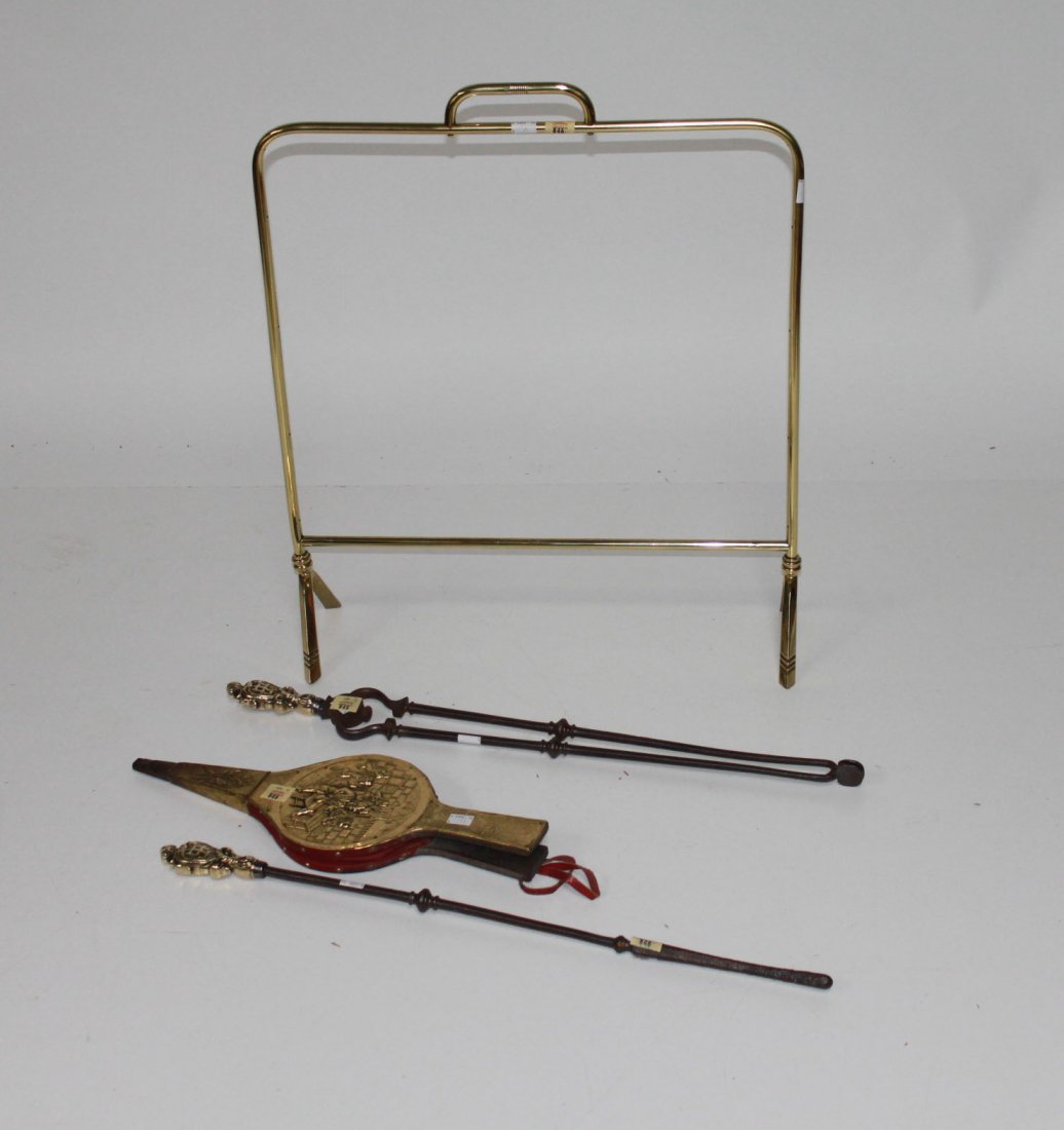 A cheval firescreen, Edwardian, lacking panel; a p: A cheval firescreen, Edwardian, lacking panel; a pair of brass mounted steel fire irons and a brass bellows. (4).