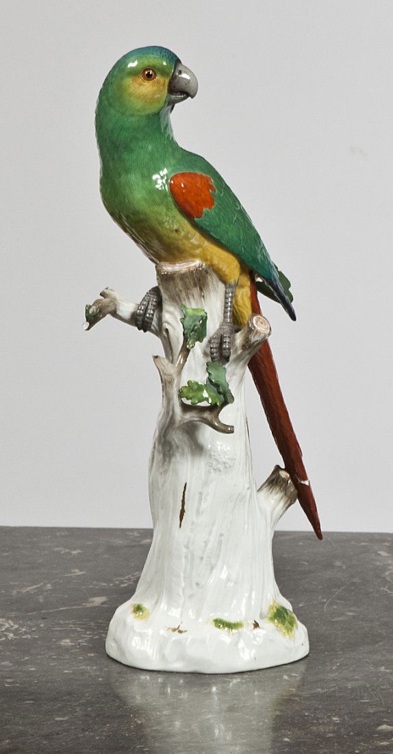 A Meissen model of a South American Parrot,: A Meissen model of a South American Parrot, 19th Century, blue crossed swords mark, incised 20, Pressnumer 127, naturalistically modelled perched on a tree-strump, its plumage predominantly green, yel