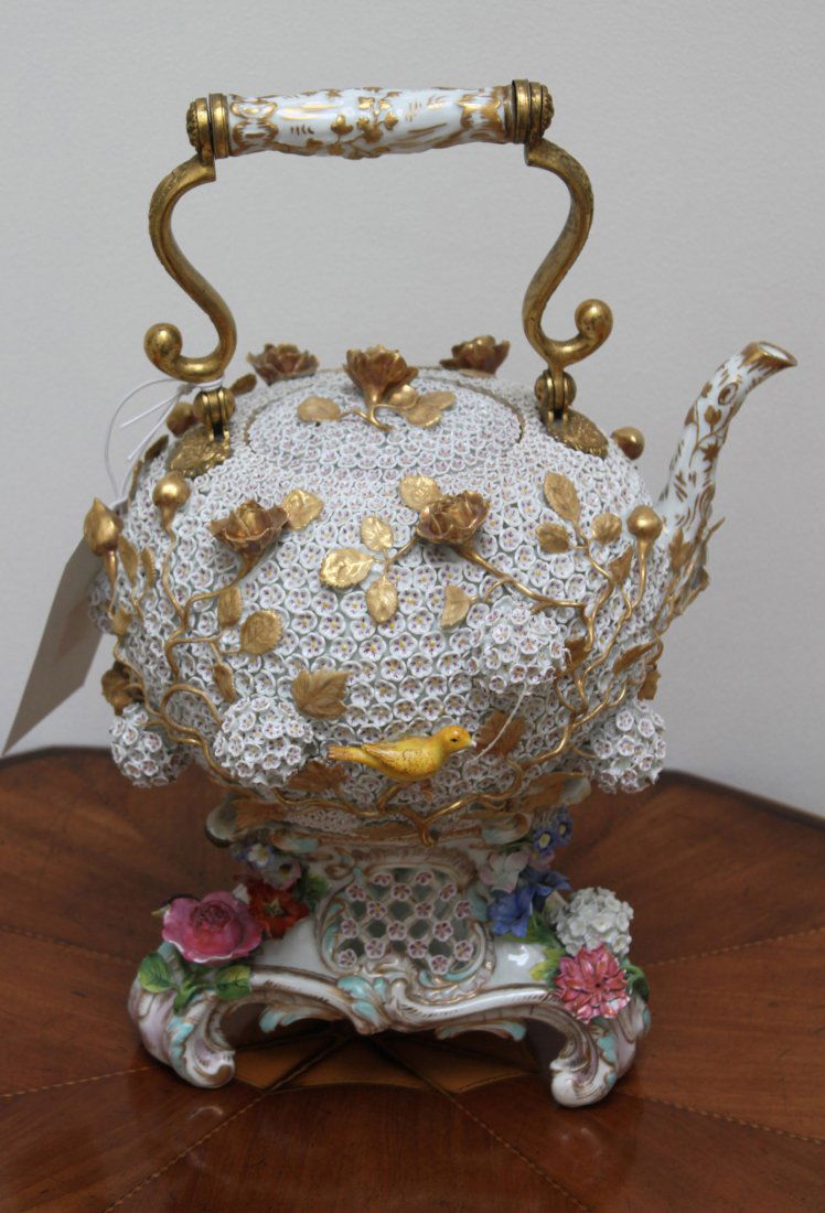 A Meissen Schneeballen Tea-kettle, cover and a stan: A Meissen Schneeballen Tea-kettle, cover and a stand, mid-19th Century, blue crossed swords mark, the globular tea-kettle with ormolu mounts, moulded with S-scrolls supporting a crab-stock handle, the